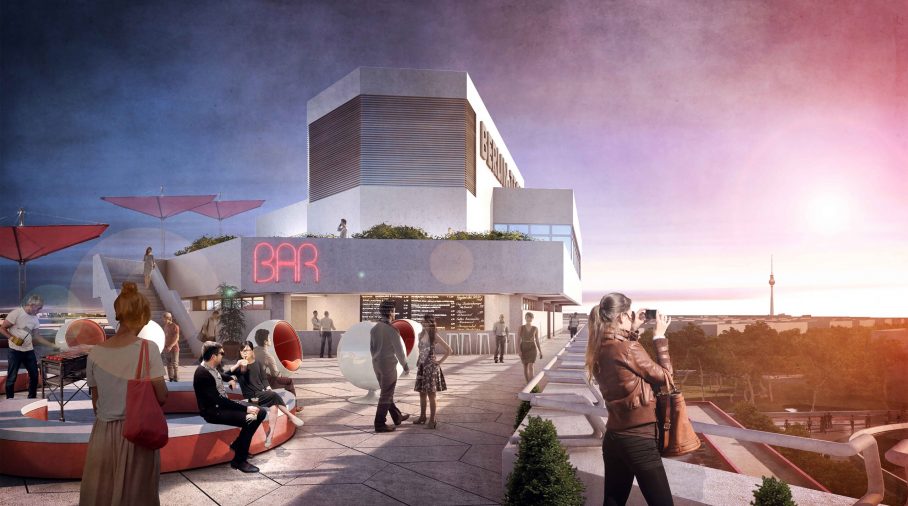 People in front of a bar in the early evening.